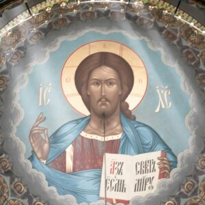 a painting of jesus on the ceiling of a church