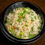 a bowl of rice with vegetables